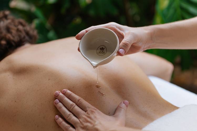 A man enjoys the Ligne St Barth treatment at the Grand Hotel Binz with soothing extracts.