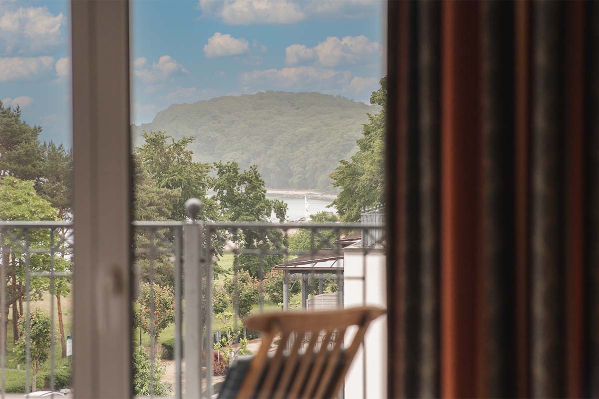 View from the Granitz Deluxe Room with roof terrace overlooking the surroundings of the island of Rügen and the sea.